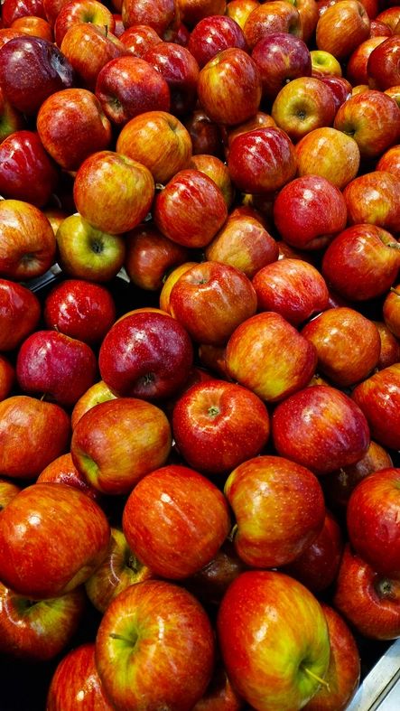colorful fruit selection, apples, oranges, bananas, grapes, arranged, grocery store
